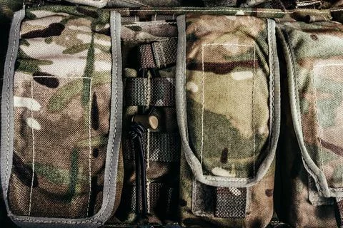 Multi-cam front view soldier pouches close-up photo. Stock-Fotos