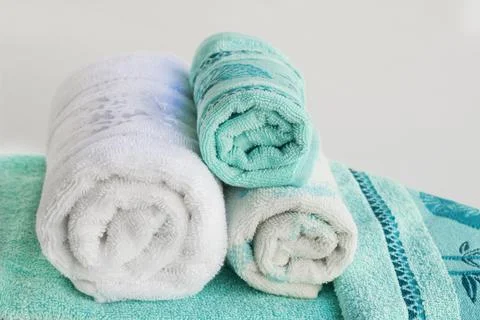 Multi color bath and face towels on white Stock Photos