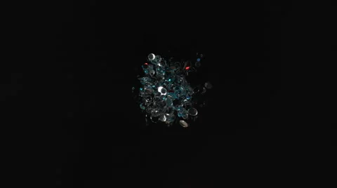 Multi color confetti fly after being exploded. 4K 30fps. Slow Motion. Stock Footage 55534240