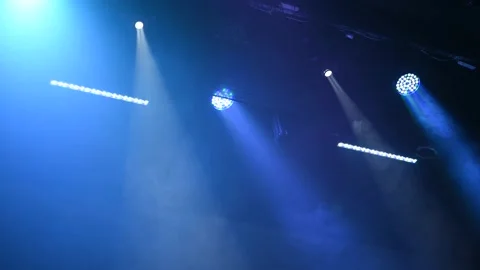 Multi-color light on dark stage in fog Stock Footage 152345084