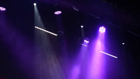 Multi-color light on dark stage in fog Stock Footage 152345116