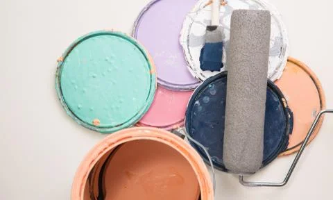 Multi color old paint can lids Stock Photos