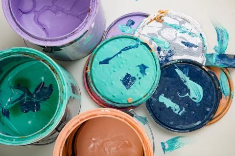 Multi color old paint can lids Stock Photos