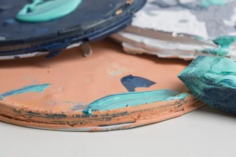 Multi color old paint can lids Stock Photos