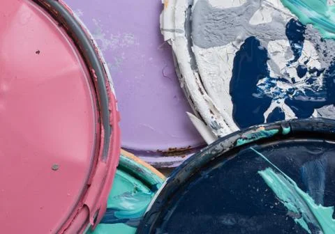 Multi color old paint can lids Stock Photos