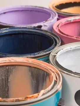 Multi color old paint cans Stock Photos