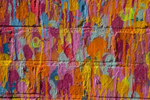 Multi-color paint on brick wall Stock Photos