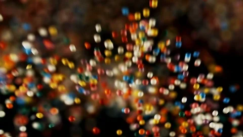 Multi color particles flying, colorful rainbow sprinkles bouncing falling down Stock Footage 106786476