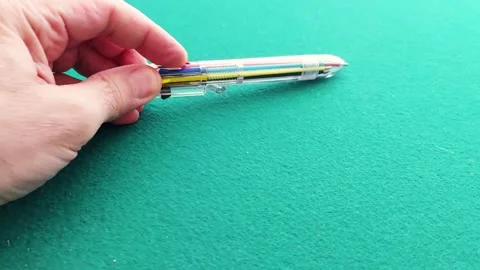 Multi-Color Pen Test: Precision Ink on Green Surface 스톡 동영상 310933656