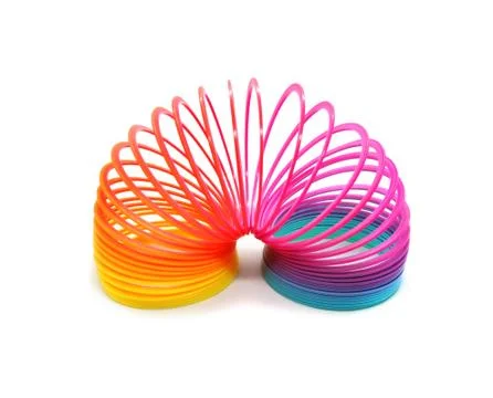 Multi-color plastic spring for playing isolated on white background. Foto stock