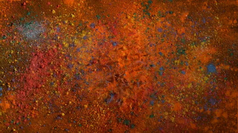 Multi color powder/particles fly after being exploded. 4K 30fps. Slow Motion. Stock Footage 55534652