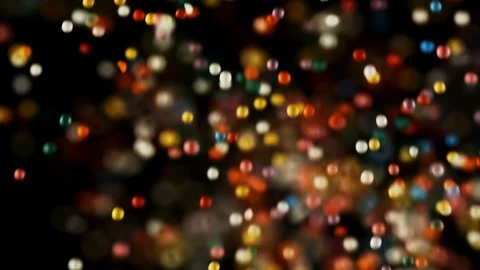 Multi color round particles flying falling down on black background Stock Footage 106787261