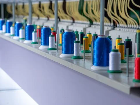 Multi-Color Thread Spools on Industrial Embroidery Machine Stock Photos