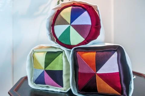 Multi-color woven fabric patchwork on display Stock Photos