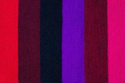 Multi colored background. knitted wool fabric texture with stripes Foto stock