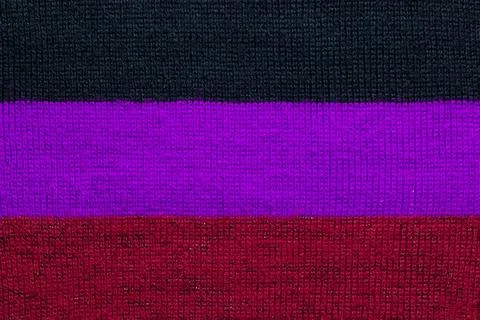 Multi colored background. knitted wool fabric texture with stripes Stock Photos