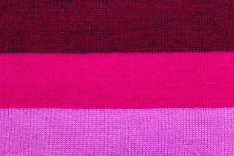 Multi colored background. knitted wool fabric texture with stripes Foto stock