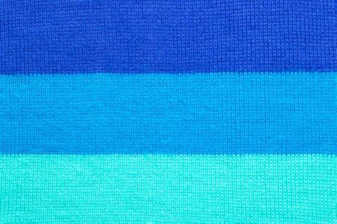 Multi colored background. knitted wool fabric texture with stripes Stock Photos