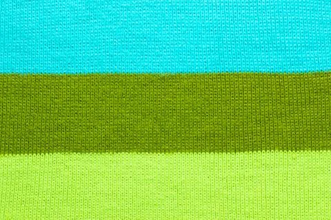 Multi colored background. knitted wool fabric texture with stripes Stock-Fotos