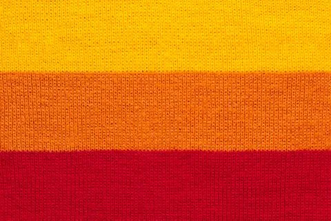 Multi colored background. knitted wool fabric texture with stripes Stock Photos