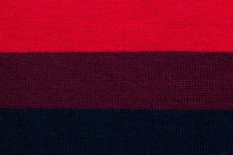 Multi colored background. knitted wool fabric texture with stripes Stock Photos
