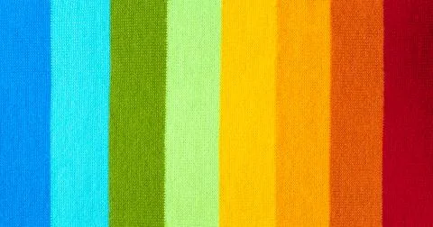 Multi colored background. knitted wool fabric texture with stripes Stock Photos