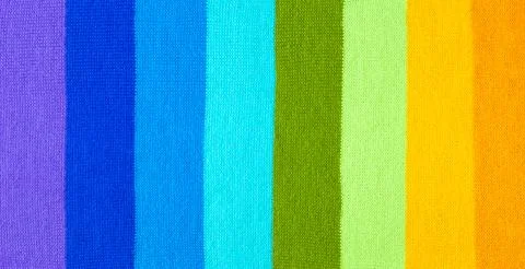 Multi colored background. knitted wool fabric texture with stripes Foto stock