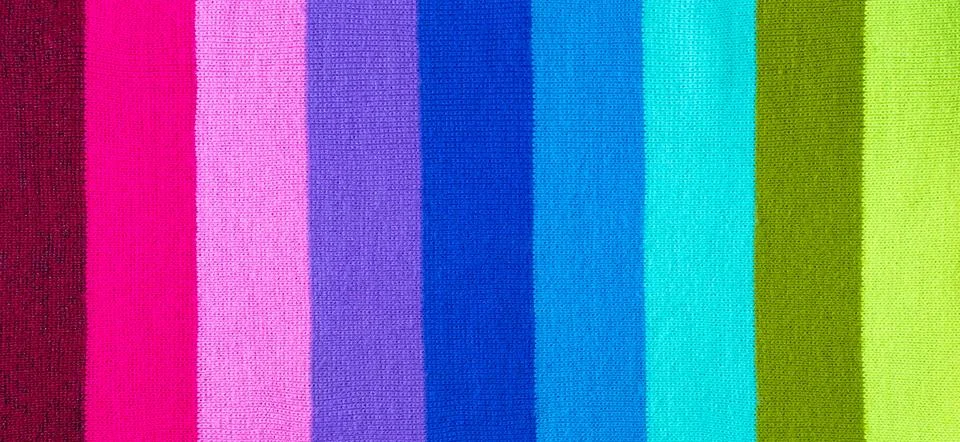 Multi colored background. knitted wool fabric texture with stripes Stock Photos