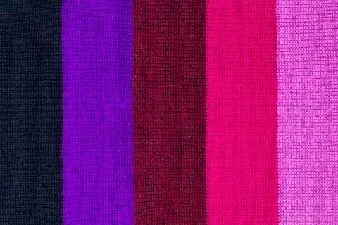 Multi colored background. knitted wool fabric texture with stripes Stock Photos