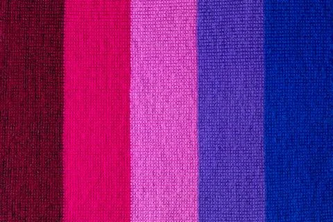 Multi colored background. knitted wool fabric texture with stripes Stock Photos
