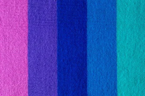Multi colored background. knitted wool fabric texture with stripes Stock Photos