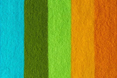 Multi colored background. knitted wool fabric texture with stripes Foto stock