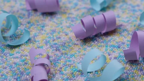 Multi-colored background in pastel delicate colors with sprinkles Stock Footage 219207591