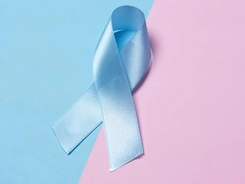 On multi-colored backgrounds pink and blue satin ribbon symbol of prostate ca Stock Photos