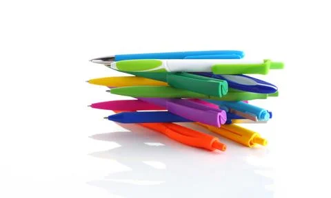 Multi colored ball pens on white background 스톡 사진