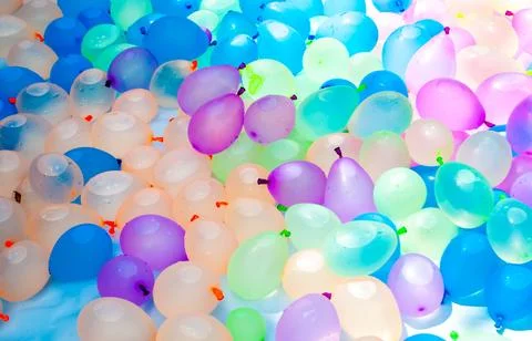 Multi-colored balloons filled with water prepared for the game Stock Photos
