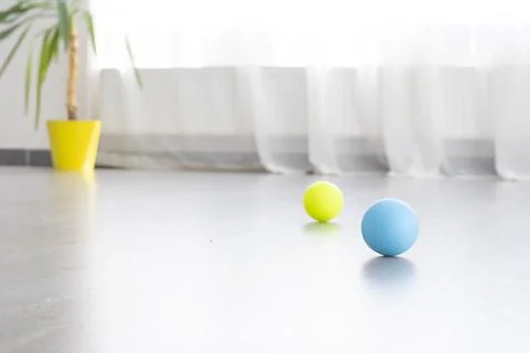Multi colored balls for MFR on background light window. Concept Reflexology Stock Photos