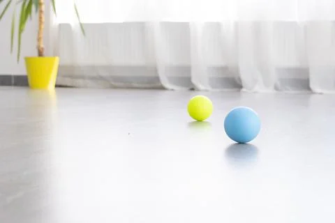 Multi colored balls for MFR on background light window. Concept Reflexology Stock Photos