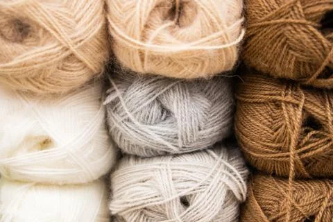 Multi-colored balls of yarn for knitting. Woolen threads for needlework Stock Photos