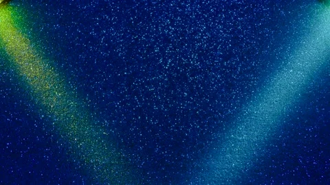 Multi-colored beams of light blink on a dark background. Stock Footage 195700368