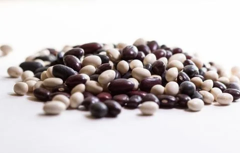 Multi-colored beans on a white background. Red and white beans. Stock Photos