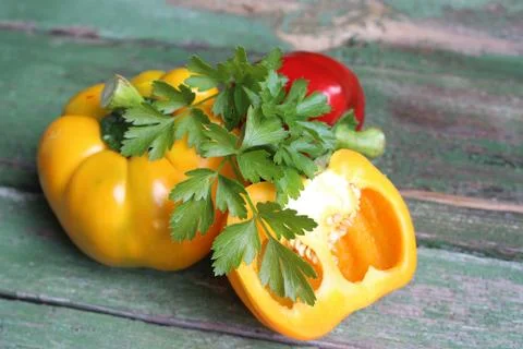 Multi-colored bell peppers on the background of boards Stock Photos