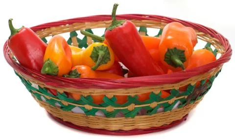 Multi colored bell peppers in basket Stock Photos