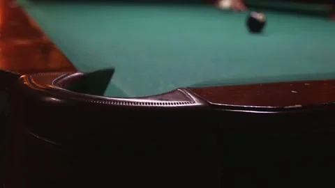 Multi-colored billiard balls scatter from a cue hit in video Stock Footage 339029227