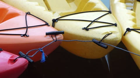 Multi-colored boats connected to each other near from the pier. Stock Footage 140645341