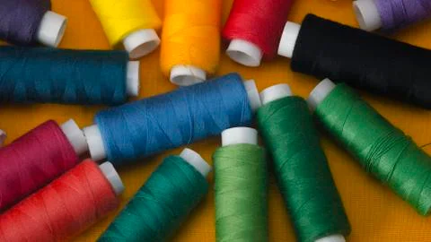Multi-Colored bobbins of thread. Close up. Stock Photos
