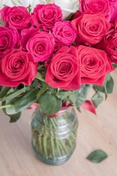 Multi-colored bouquet of red, pink and white roses in a vase Stock Photos