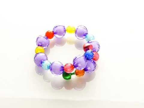 Multi-colored bracelets with beads. Colourful child's bead bracelet.. Stock Photos