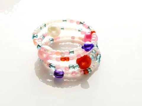 Multi-colored bracelets with beads. Colourful child's bead bracelet.. Stock Photos
