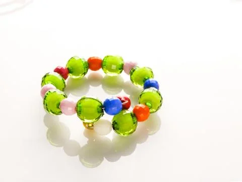Multi-colored bracelets with beads. Colourful child's bead bracelet.. Stock Photos